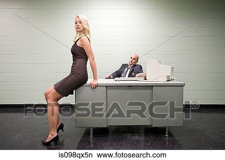 Picture - Woman sitting on detectives desk. Fotosearch