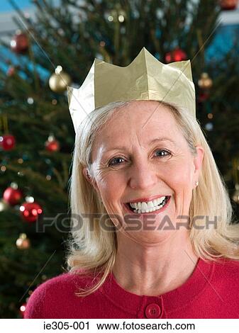 Stock Image - Woman wearing a party hat. Fotosearch