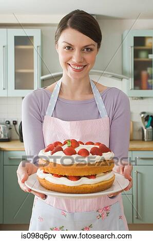 Stock Photo - Woman with a cake. Fotosearch