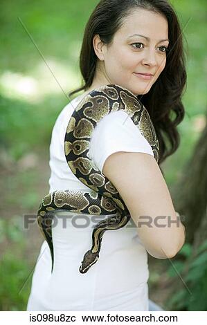 Stock Image - Woman with a snake. Fotosearch