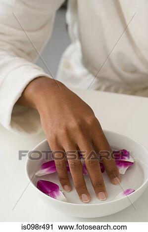 Woman with fingers in bowl View Large Photo Image Stock Image - Woman with fingers in bowl. Fotosearch