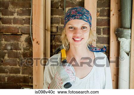 Woman with hammer, portrait View Large Photo Image Stock Image - Woman with hammer, portrait. Fotosearch