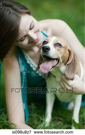 Woman with her pet beagle View Large Photo Image Stock Photo - Woman with her pet beagle. Fotosearch