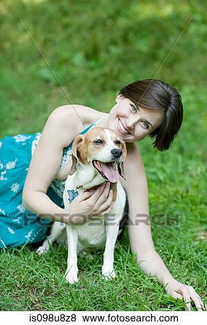 Stock Photo - Woman with her pet beagle. Fotosearch