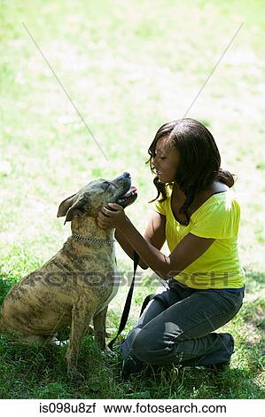 Woman with her pet dog View Large Photo Image Stock Image - Woman with her pet dog. Fotosearch