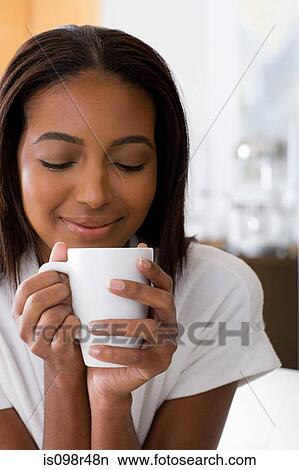 Woman with hot drink View Large Photo Image Picture - Woman with hot drink. Fotosearch