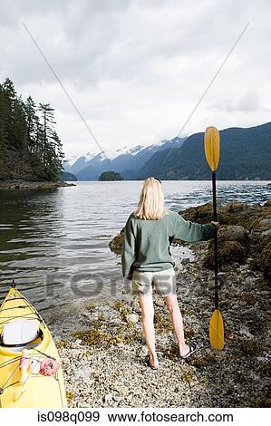 Stock Photo - Woman with kayak. Fotosearch