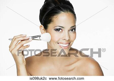 Woman with makeup brush View Large Photo Image Stock Image - Woman with makeup brush. Fotosearch