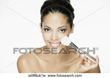 Stock Photo - Woman with makeup brush. Fotosearch