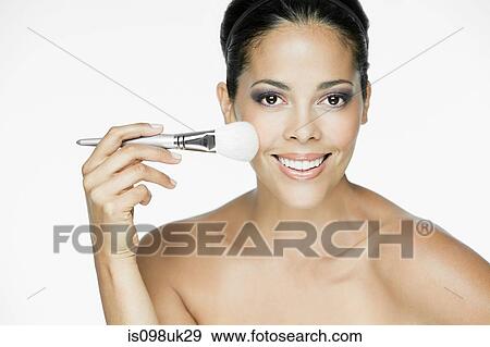 Stock Photo - Woman with makeup brush. Fotosearch