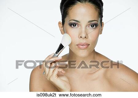 Stock Photograph - Woman with makeup brush. Fotosearch