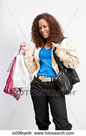 Stock Photography - Woman with shopping bags. Fotosearch
