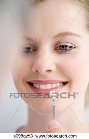 Woman with tooth veneer View Large Photo Image Stock Photo - Woman with tooth veneer. Fotosearch