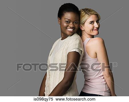 Stock Photography - Women back to back. Fotosearch