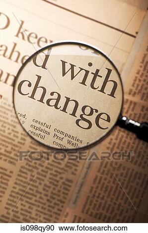 Stock Image - Word change under magnifying glass. Fotosearch