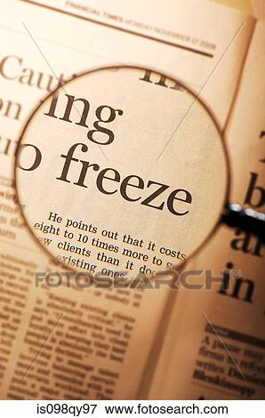 Stock Photo - Word freeze under magnifying glass. Fotosearch