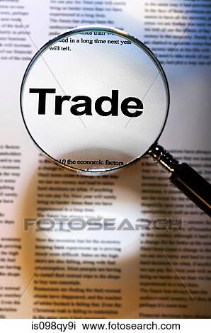 Stock Image - Word trade under magnifying glass. Fotosearch