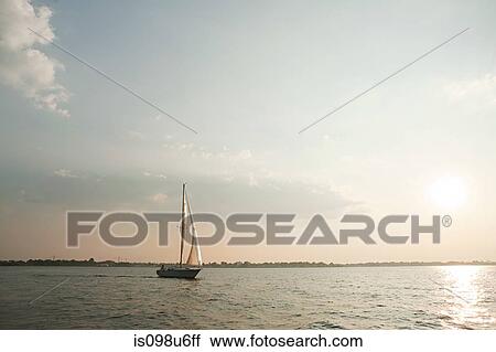 Yacht sailing on sea View Large Photo Image Stock Image - Yacht sailing on sea. Fotosearch