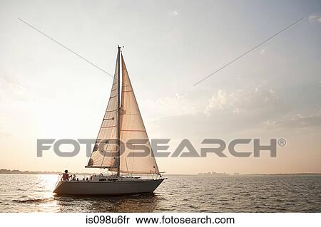 Yacht sailing on sea View Large Photo Image Stock Photography - Yacht sailing on sea. Fotosearch