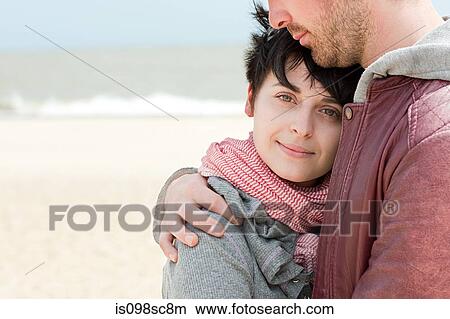 Young couple at the beach View Large Photo Image Picture - Young couple at the beach. Fotosearch
