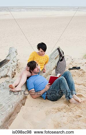 Young couple at the beach View Large Photo Image Stock Photo - Young couple at the beach. Fotosearch