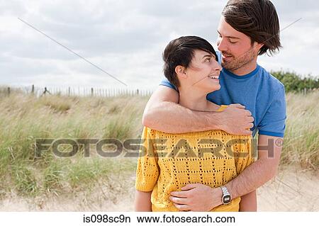 Young couple at the coast View Large Photo Image Picture - Young couple at the coast. Fotosearch