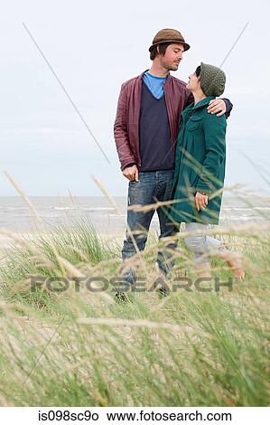 Picture - Young couple at the coast. Fotosearch