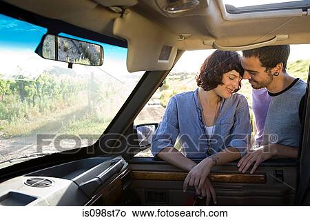 Young couple by automobile View Large Photo Image Picture - Young couple by automobile. Fotosearch