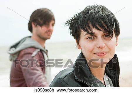 Stock Image - Young couple by the sea. Fotosearch