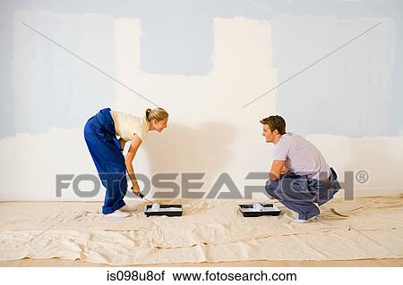 Young couple decorating View Large Photo Image Stock Image - Young couple decorating. Fotosearch