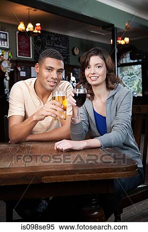Young couple in bar View Large Photo Image Stock Photography - Young couple in bar. Fotosearch