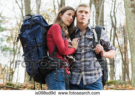 Stock Image - Young couple in forest. Fotosearch