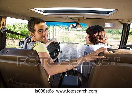 Picture - Young couple in vehicle. Fotosearch