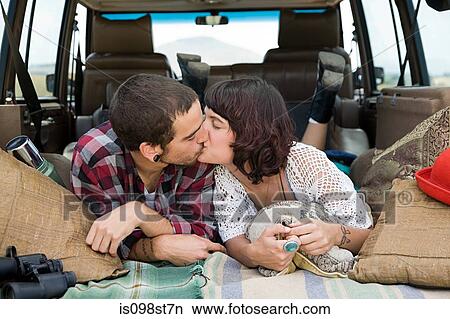 Young couple kissing in back of suv View Large Photo Image Picture - Young couple kissing in back of suv. Fotosearch