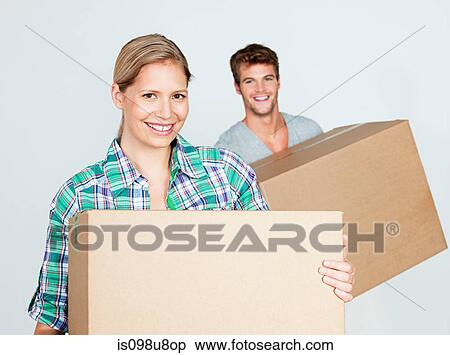 Young couple with cardboard boxes View Large Photo Image Stock Photography - Young couple with cardboard boxes. Fotosearch