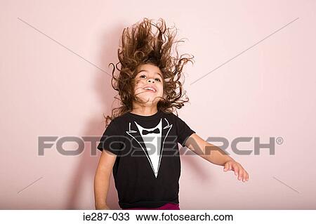 Stock Image - Young girl jumping. Fotosearch
