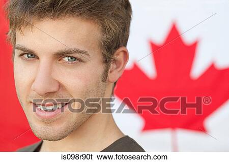 Stock Photograph - Young man and and canadian flag. Fotosearch