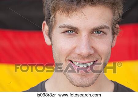 Young man and and german flag View Large Photo Image Stock Photography - Young man and and german flag. Fotosearch