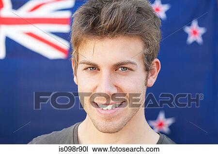 Stock Image - Young man and and new zealand flag. Fotosearch