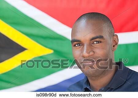 Stock Image - Young man and and south african flag. Fotosearch