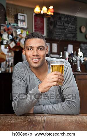 Stock Photography - Young man in bar. Fotosearch