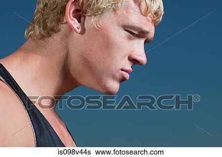 Young man in sportswear, portrait View Large Photo Image Stock Photograph - Young man in sportswear, portrait. Fotosearch