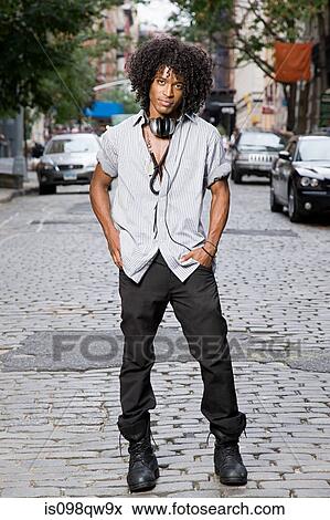 Stock Photo - Young man in street. Fotosearch