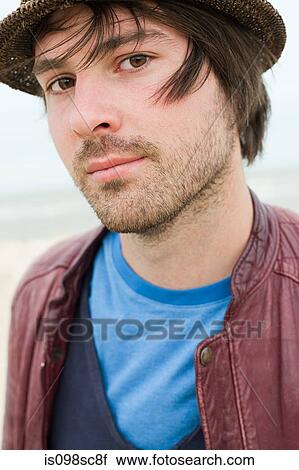 Stock Image - Young man outdoors. Fotosearch