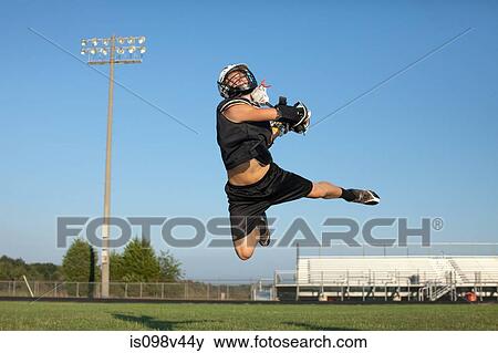 Young man playing lacrosse View Large Photo Image Stock Photo - Young man playing lacrosse. Fotosearch