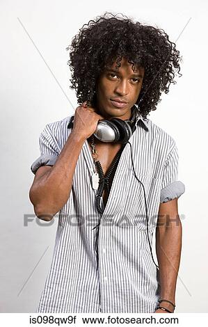 Stock Image - Young man with headphones. Fotosearch