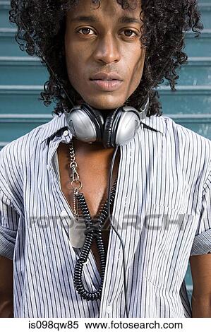 Young man with headphones View Large Photo Image Stock Photography - Young man with headphones. Fotosearch