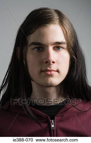 Young man with long hair View Large Photo Image Stock Image - Young man with long hair. Fotosearch