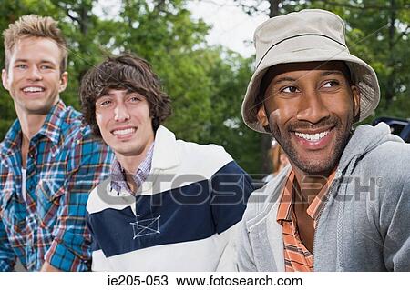 Young men looking away View Large Photo Image Stock Image - Young men looking away. Fotosearch