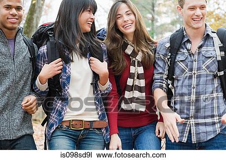 Young people in forest View Large Photo Image Stock Image - Young people in forest. Fotosearch